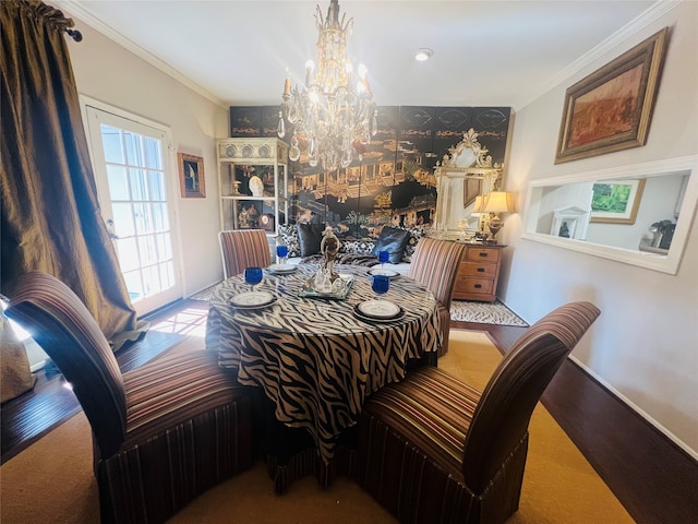 dining area featuring an inviting chandelier, ornamental molding, and carpet