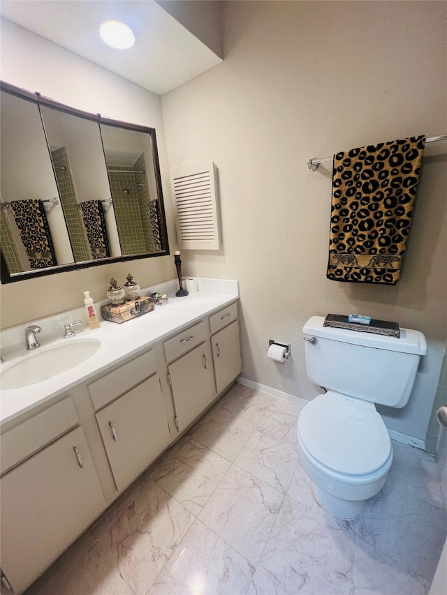 bathroom with walk in shower, vanity, and toilet