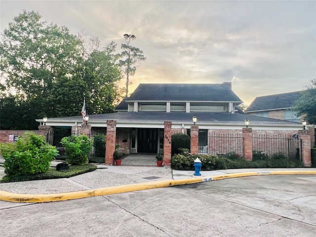 view of outdoor building at dusk