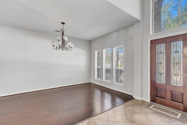 13607 Breakwater Path Loop, Houston, TX 77044 - foyer with a chandelier, baseboards, and tile patterned floors