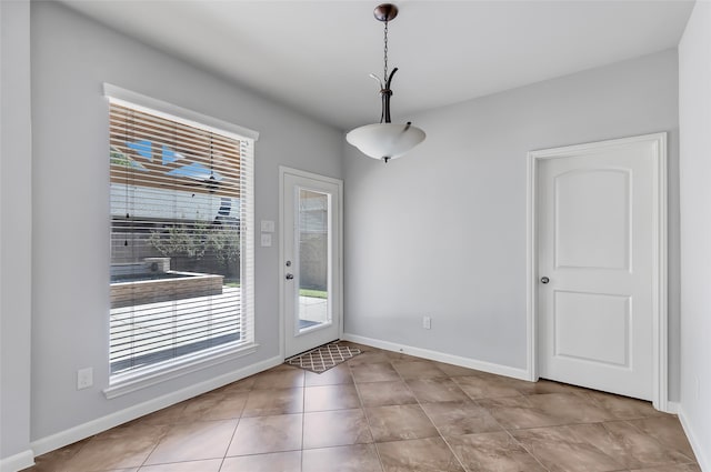 doorway to outside featuring light tile patterned floors