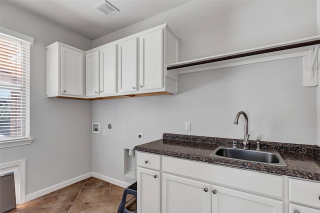 washroom featuring washer hookup, electric dryer hookup, a healthy amount of sunlight, and sink