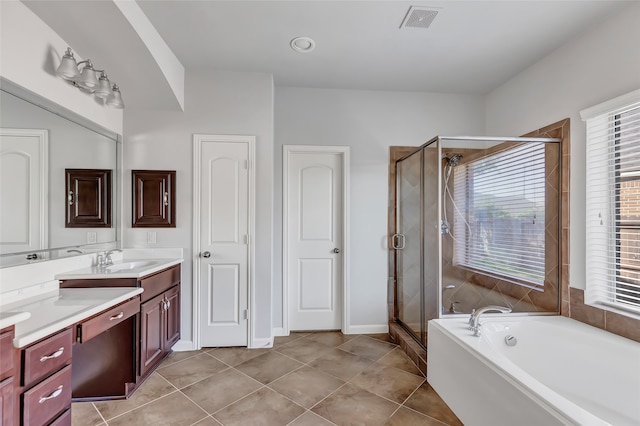 bathroom featuring vanity, plus walk in shower, and tile patterned floors