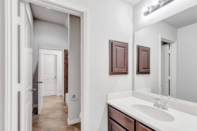 bathroom featuring tile patterned flooring and vanity