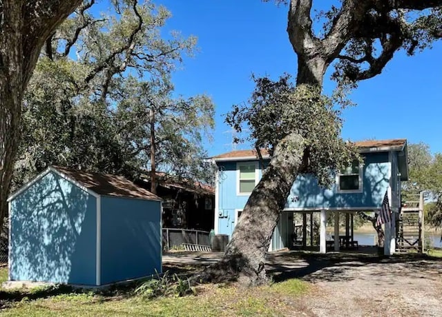 back of property with a shed