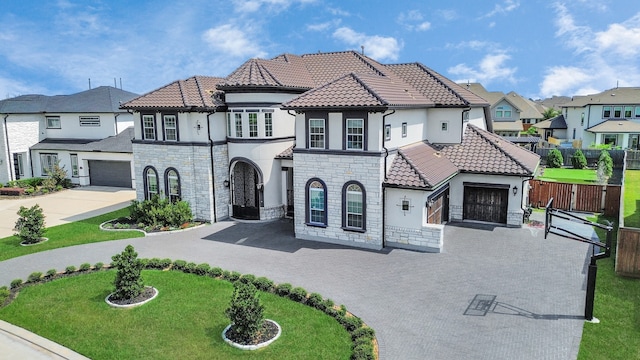 view of front of house with a garage and a front yard