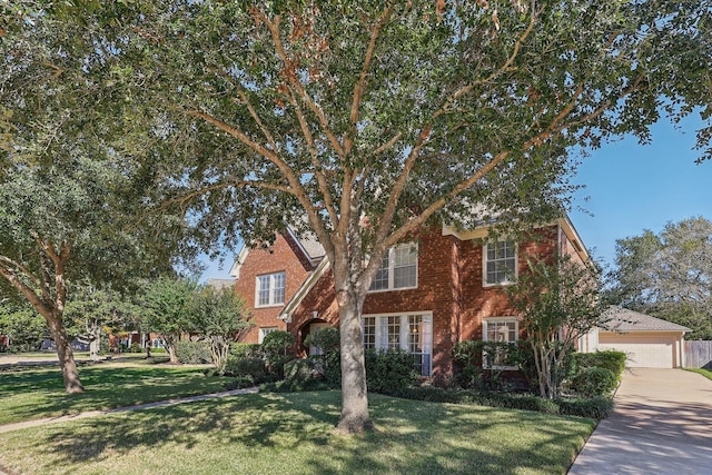 view of front of home with a front yard and a garage