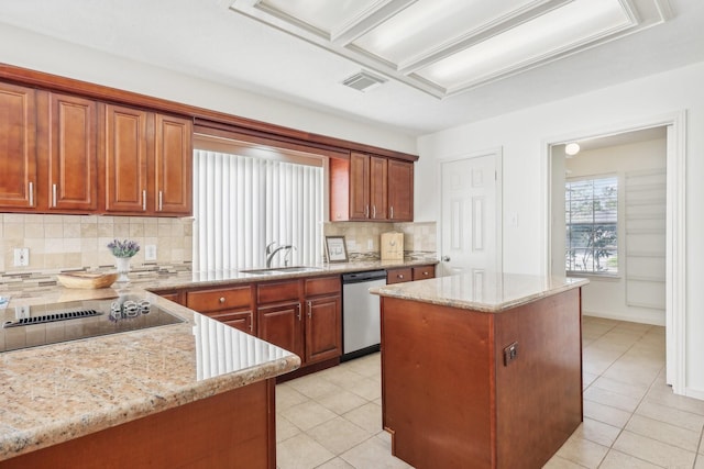 kitchen featuring backsplash, sink, a center island, and stainless steel dishwasher