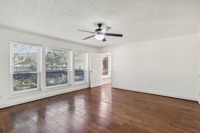 unfurnished room featuring ornamental molding, a textured ceiling, ceiling fan, and dark wood-type flooring