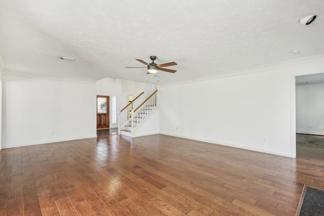 unfurnished living room with a textured ceiling, ceiling fan, dark hardwood / wood-style flooring, and crown molding