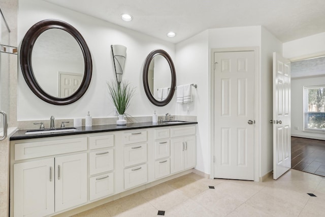 bathroom featuring hardwood / wood-style flooring and vanity