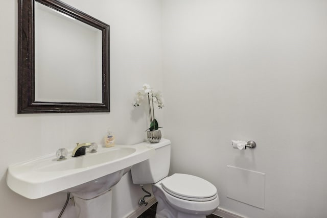 bathroom with sink and toilet