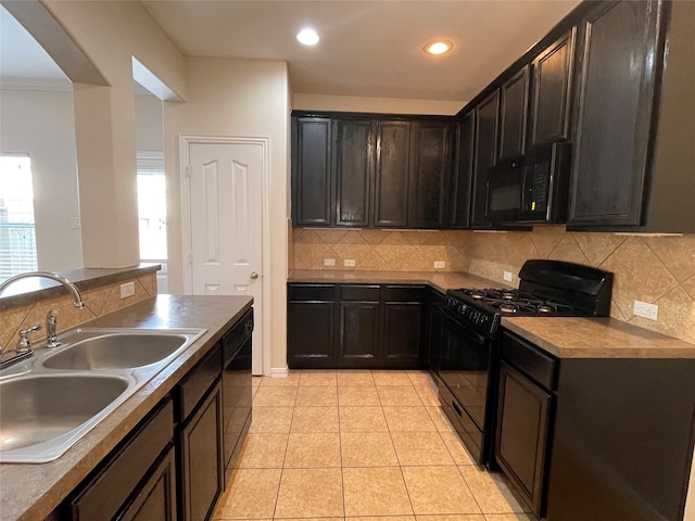 kitchen with decorative backsplash, black appliances, light tile patterned floors, and sink