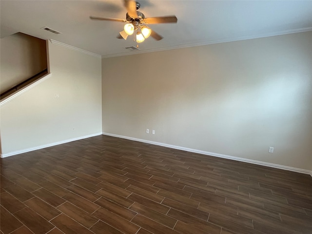 empty room featuring ceiling fan, crown molding, and dark hardwood / wood-style flooring