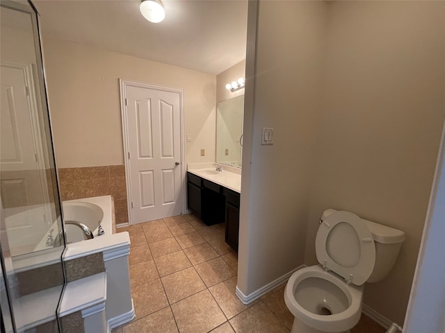 full bathroom featuring vanity, separate shower and tub, toilet, and tile patterned floors