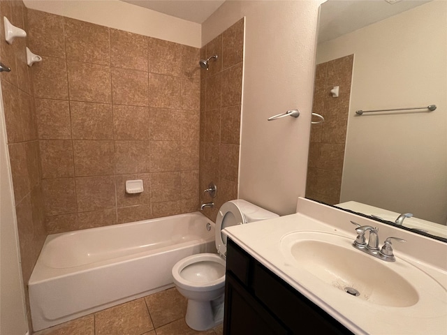 full bathroom with tiled shower / bath combo, vanity, toilet, and tile patterned floors