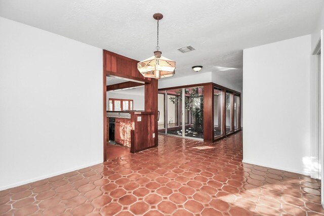 interior space featuring a textured ceiling