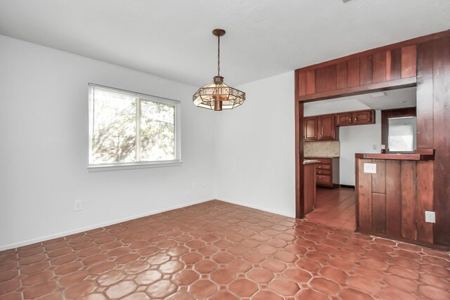 unfurnished dining area with tile patterned floors