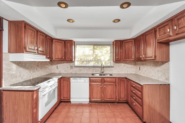 kitchen with decorative backsplash, sink, and white appliances