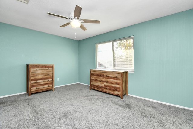 unfurnished bedroom featuring carpet and ceiling fan