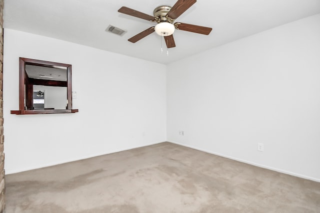 unfurnished room featuring ceiling fan and carpet floors