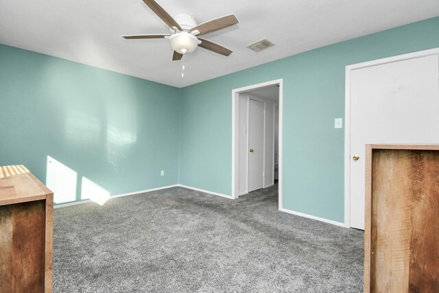 unfurnished bedroom featuring carpet floors and ceiling fan