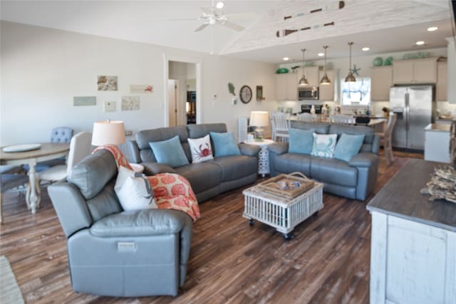 living room featuring high vaulted ceiling, ceiling fan, and dark wood-type flooring