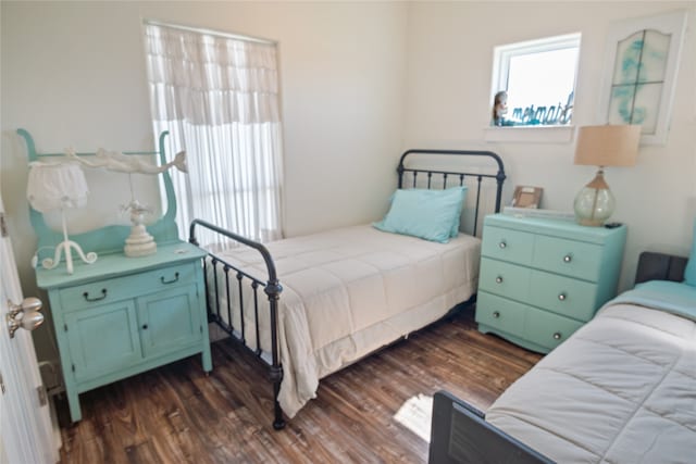 bedroom featuring dark hardwood / wood-style flooring