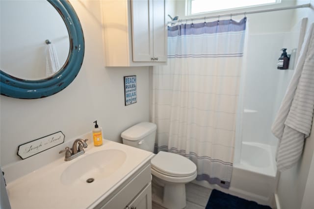 full bathroom featuring vanity, toilet, and shower / bathtub combination with curtain