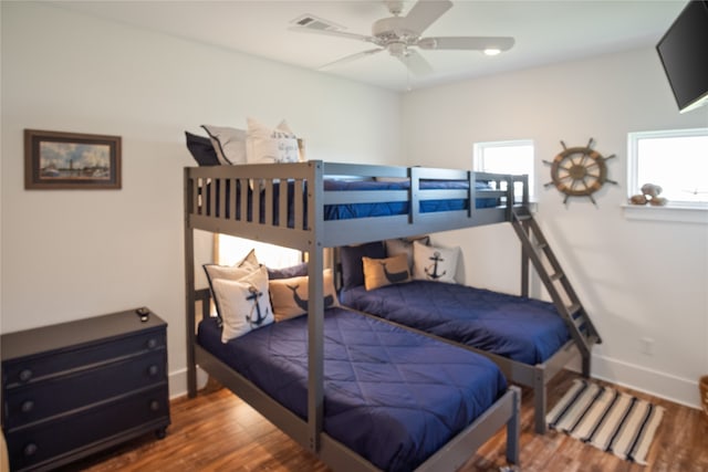 bedroom featuring ceiling fan and dark hardwood / wood-style flooring