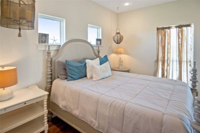 bedroom with hardwood / wood-style flooring