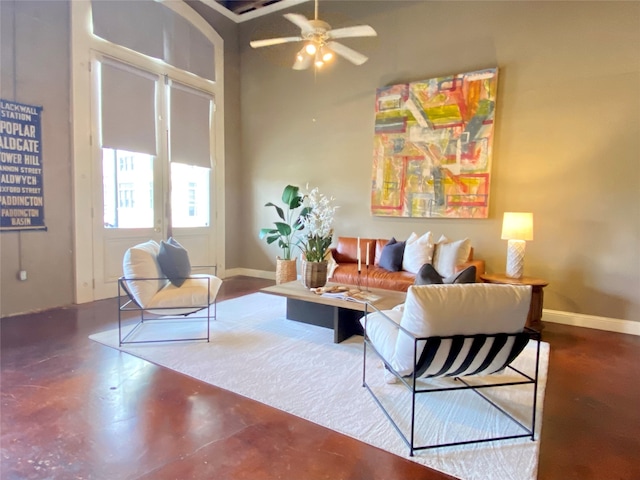 living room featuring concrete flooring and ceiling fan