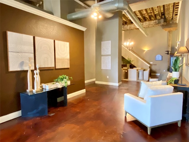 living room featuring ceiling fan with notable chandelier