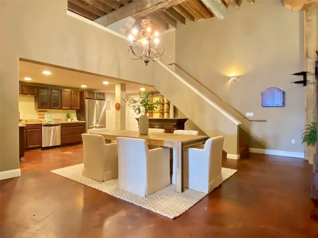 interior space with an inviting chandelier and a high ceiling