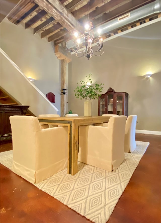 sitting room featuring wood-type flooring, a chandelier, and beamed ceiling