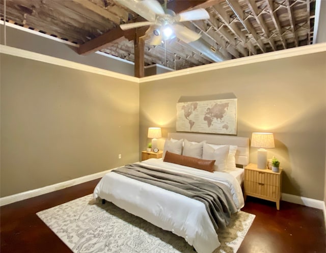 bedroom with ornamental molding, a high ceiling, and ceiling fan