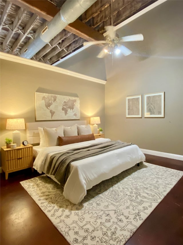 bedroom with beamed ceiling, hardwood / wood-style floors, and ceiling fan