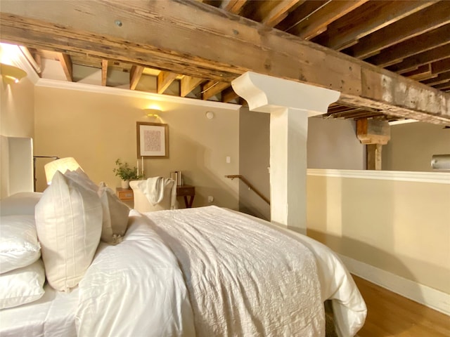 bedroom with wood-type flooring