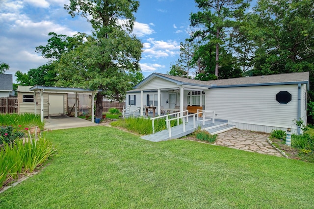 back of house featuring a patio, a yard, and a wooden deck