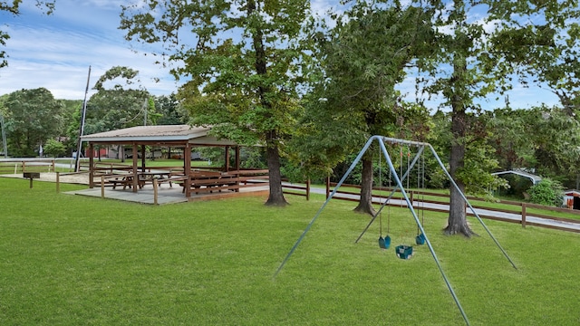 view of play area with a gazebo and a lawn