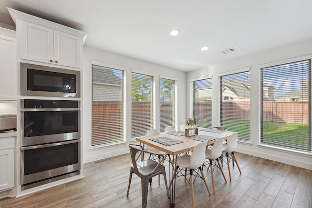 dining room with light hardwood / wood-style floors