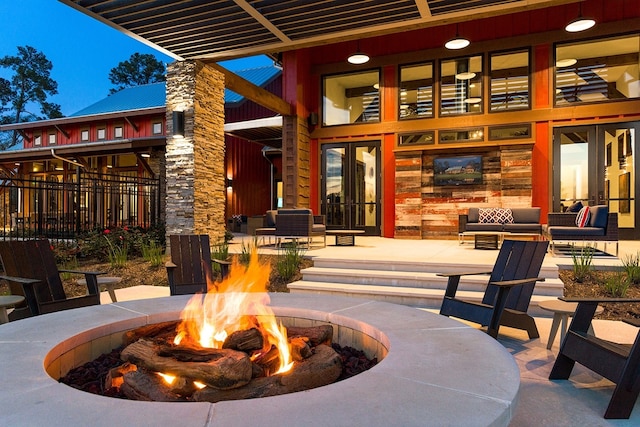 view of patio with a fire pit