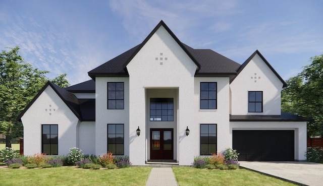 view of front of property with a front lawn and a garage