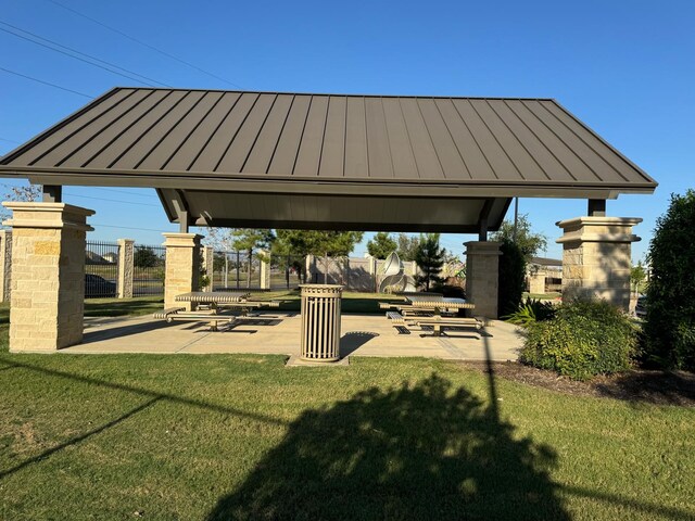 surrounding community featuring a gazebo, a patio area, and a lawn