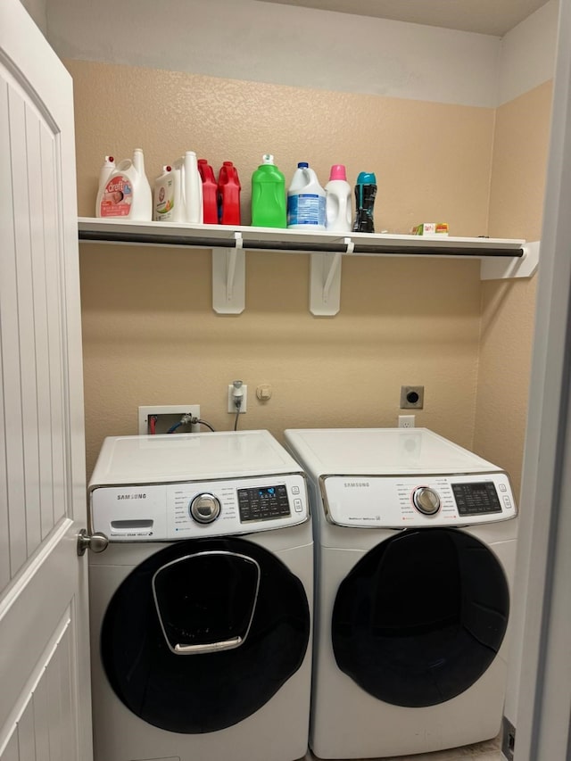 clothes washing area featuring washing machine and clothes dryer