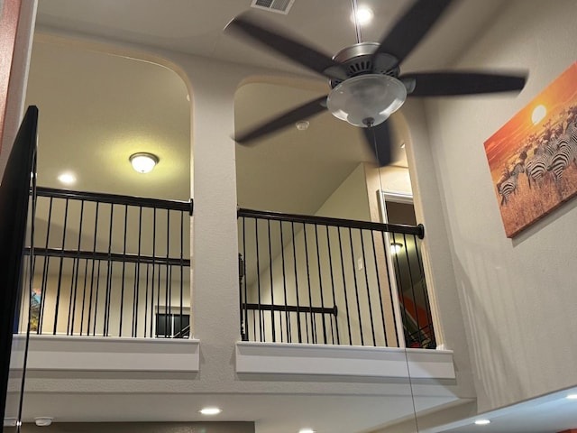 stairs with ceiling fan