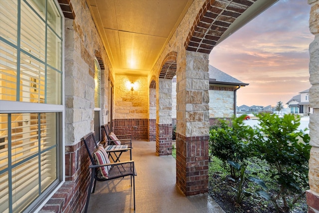 view of patio terrace at dusk