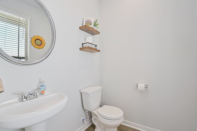 bathroom with toilet and sink