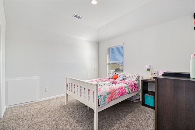 bedroom featuring vaulted ceiling and carpet flooring