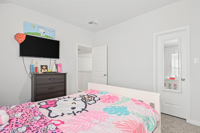 bedroom with light colored carpet